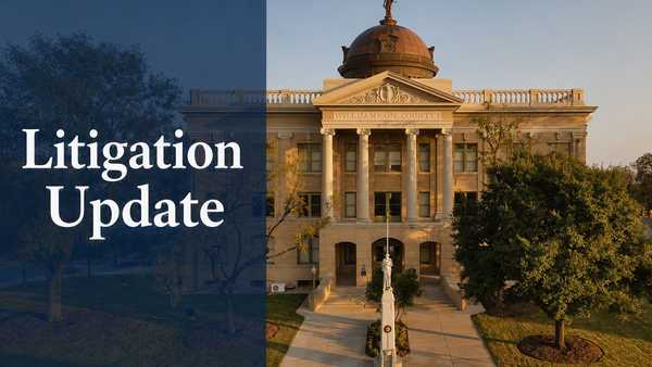 Williamson County courthouse at golden hour, with a blue overlay on the left displaying the title “Litigation Update” in large white text.